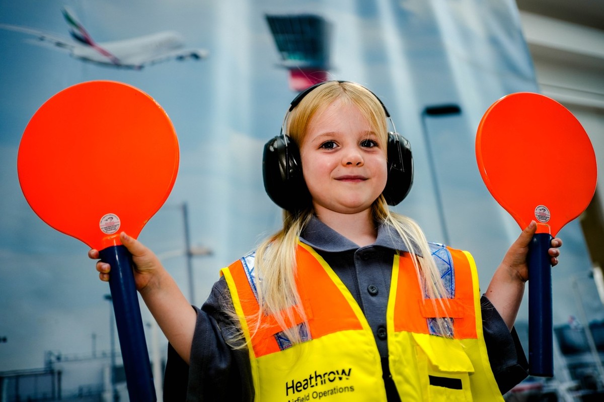 Download Image - Connie O'Connell, 5, daughter of Heathrow airside operations officer Aidan O'Connell dresses up in her dad's uniform picture