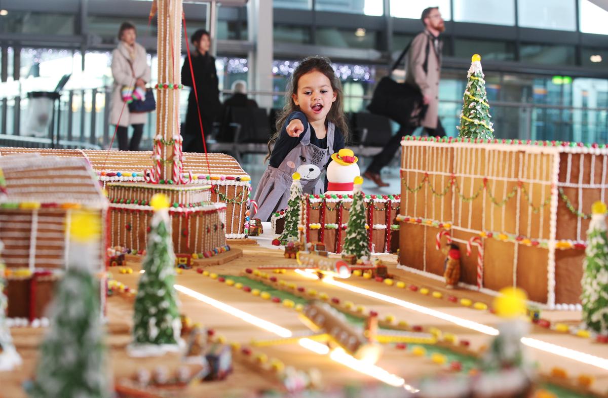 Download Image - Candice Brown unveils elaborate gingerbread model of Heathrow picture