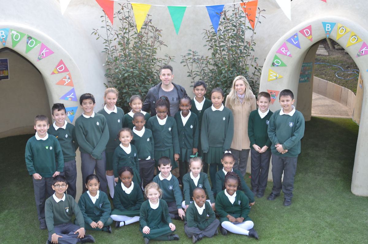 Download Image - St. Michael and St. Martin Catholic Primary students celebrate adobe building picture