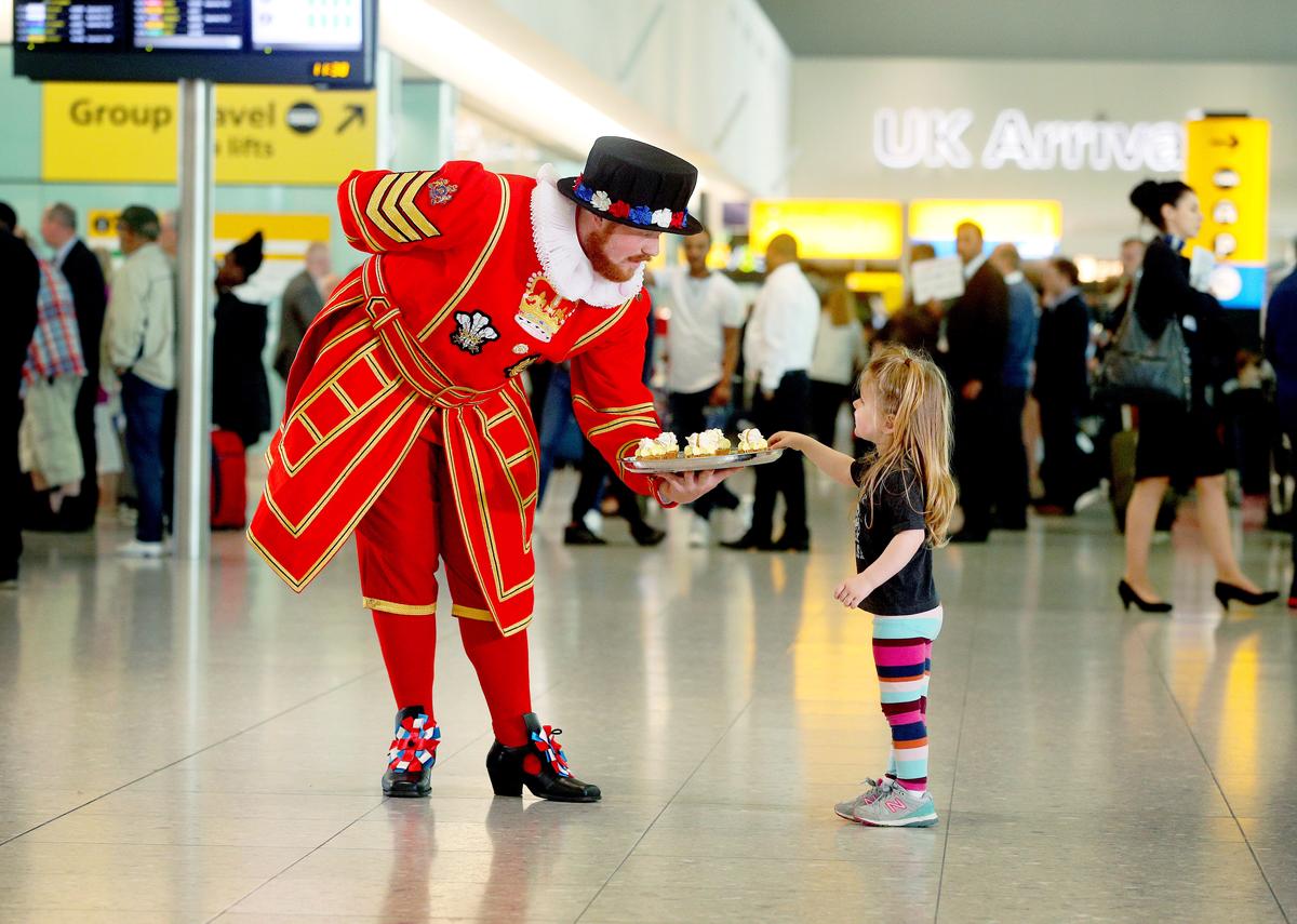 Download Image - Heathrow brings a taste of the royal wedding to arriving passengers picture