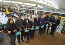 Colleagues Celebrating Living Wage Week (all paid LLW&above) - Cheif People Officer Paula Stannett with Heathrow colleagues, including represenatives from Wilson James, Mitie and Omniserve.