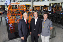 L-R - Normand Bovin (Heathrowâs Chief Operating Officer), Benedict Radcliffe (Artist) and Paul Brennan (London taxi driver)
