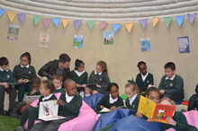 Inside St. Michael and St. Martin Catholic Primary students celebrate adobe building