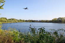 Aircraft flying over lake