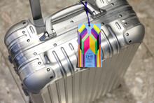 Commemorative luggage tags for the Coronation of King Charles III commissioned by Heathrow and designed by Morag Myerscough.